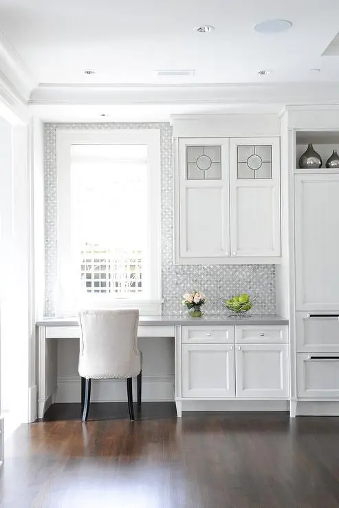 16-a-serene-white-kitchen-with-a-built-in-office-nook-with-printed-wallpaper-to-highlight-it-and-a-comfy-upholstered-chair