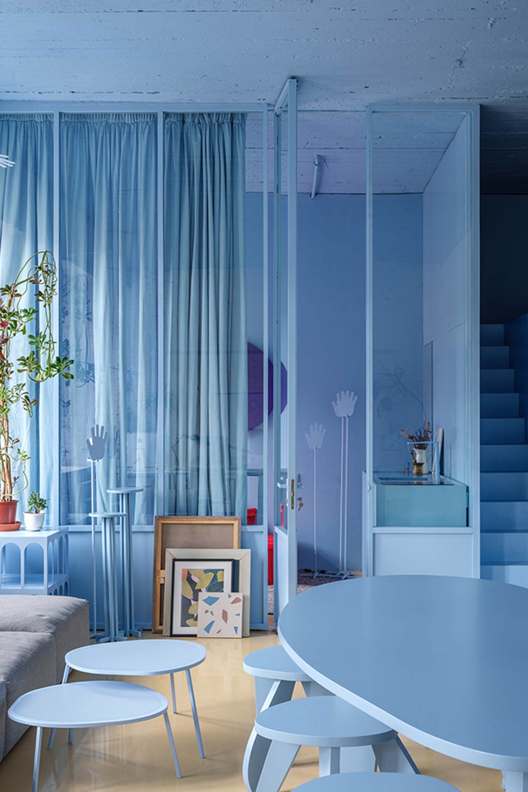 A blue monochromatic room with different textures