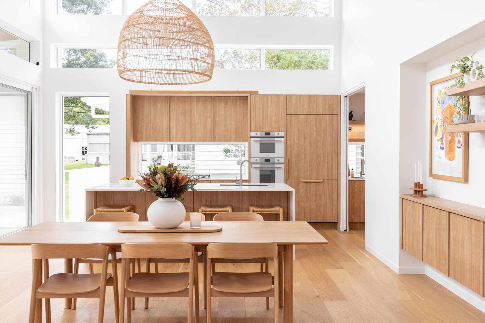 A bright home renovation for a family with the kitchen opening to the dining room and the living room