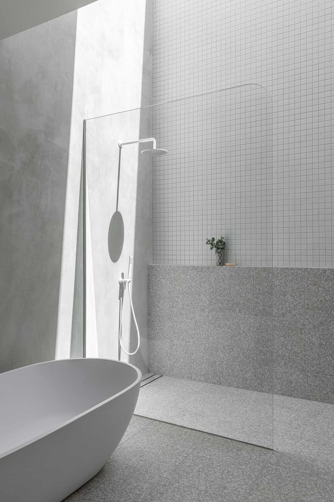 A crisp white bathroom creates a spa like experience