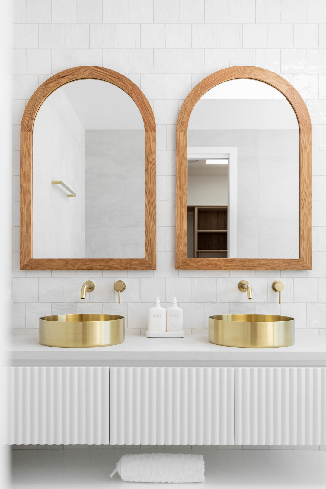 Add-a-statement-to-your-bathroom-with-a-brushed-brass-stainless-steel-above-counter-basin-round