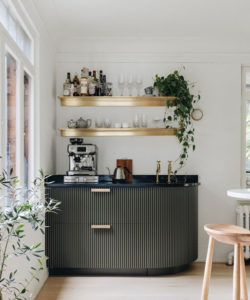 Coffee and tea bar at home deep green cabinetry with brass features