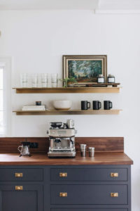 How to make a coffee bar station ideas stainless steel coffee machine with navy blue cabinetry brass handle pulls and timber benchtop and open shelves