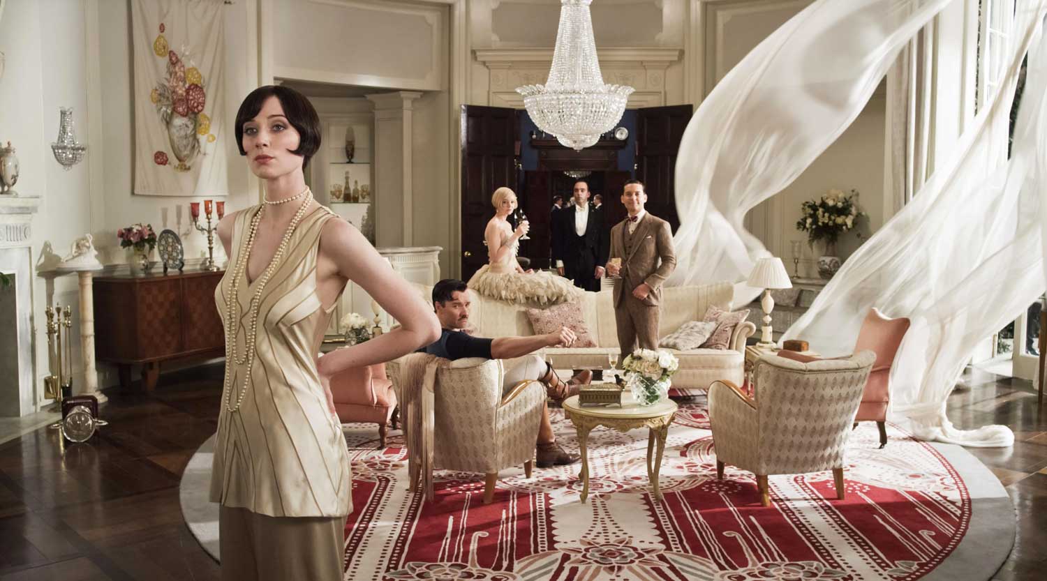 The Great Gatsby cast on set in Daisy's sitting room beautifully styled with 1920's mid century furniture a crystal chandelier and red art deco rug