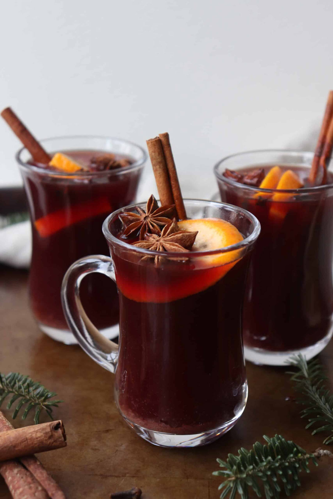 Warming mulled wine cocktails for Christmas with star anise orange and cinnamon